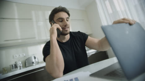 Business-man-talking-phone-at-home.-Startup-owner-call-telephone-at-home
