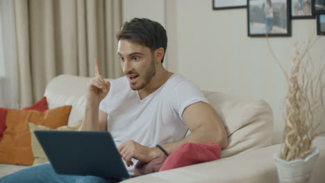 Young-man-have-idea.-Business-man-working-on-laptop-computer-at-home