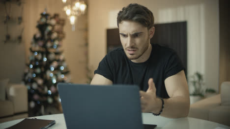 Frustrated-man-working-on-laptop-computer-at-home.-Annoyed-guy-have-trouble