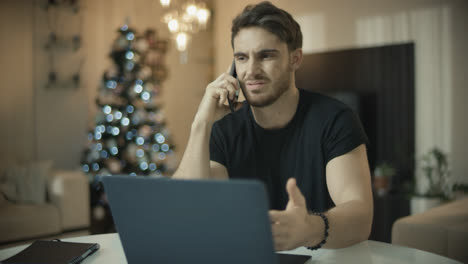 Business-man-working-at-home-at-christmas-holiday.-Entrepreneur-talking-phone