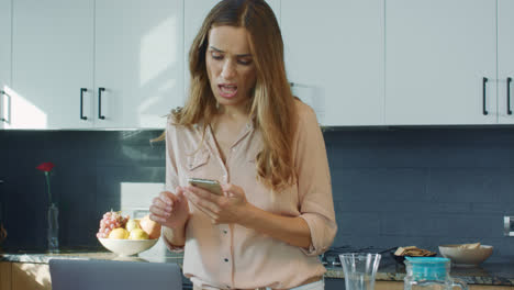 Business-woman-preparing-breakfast.-Relaxed-female-person-checking-mobile-phone
