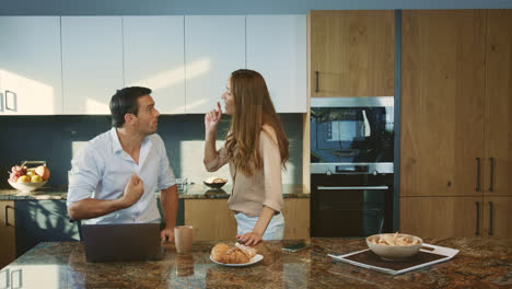 Aggressive-man-arguing-at-kitchen.-Angry-husband-having-conflict-with-wife.