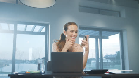 Business-woman-getting-message-at-mobile-phone.-Smiling-person-having-break.
