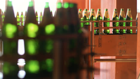 Automated-production-line-with-green-glass-bottles.-Beer-packing-line-at-factory