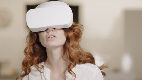 Young-lady-using-virtual-glasses.-Portrait-of-woman-sitting-with-video-glasses.