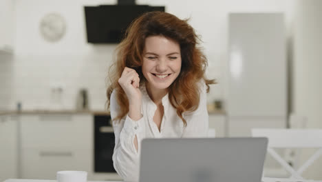 Business-woman-working-computer-at-home.-Happy-young-lady-sitting-with-laptop
