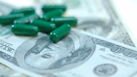 Medical-capsule-on-dollar-banknote.-Herbal-capsules-on-money-cash