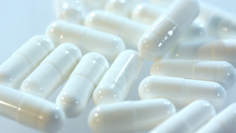Medical-capsules-on-white-table.-Medicine-pill.-Pharmacy-capsules