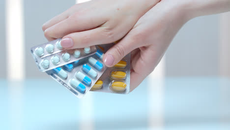 Female-hand-holding-tablet-blister.-Medical-capsule-pack.-Vitamin-pill-packaging