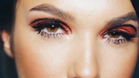 Beautiful-woman-with-painted-eyelashes-and-eyelids-winking-in-slow-motion