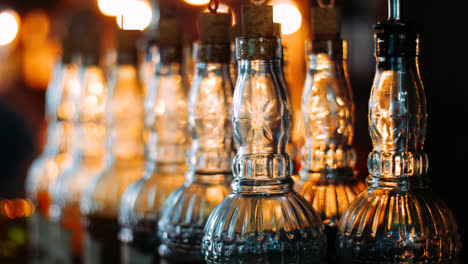 Empty-bottles-with-patterned-glass-are-used-when-spilling-alcoholic-beverages
