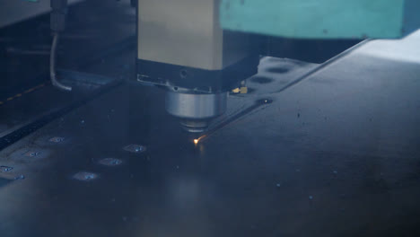Laser-cutting-of-metal-sheet-close-up.-Modern-industrial-technologies