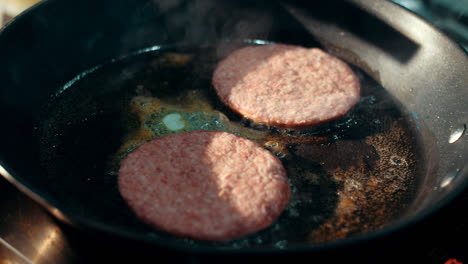 Preparation-for-hamburger-on-hot-frying-pan.-Fast-food-worker-preparing-food