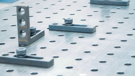 Surface-of-metal-installation-with-holes-and-plates.-Industrial-metal-surface