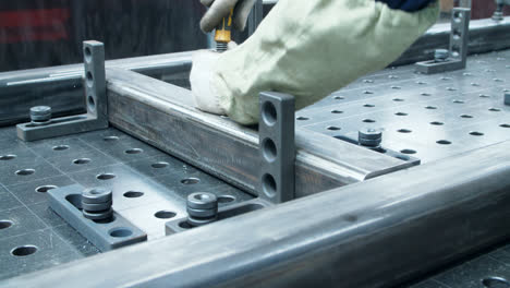 Metal-blank-is-fixed-on-special-machine.-Work-in-metalworking-work-shop