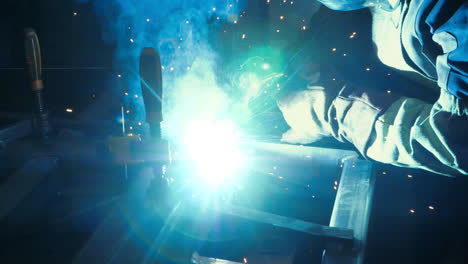 Scorching-welding-tip-during-weld-works-in-workshop-metalworking-plant