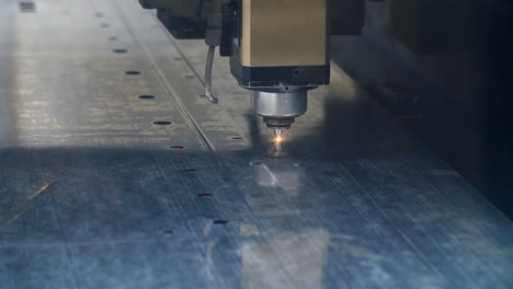 Industrial-laser-cutting-out-holes-in-metal-sheet.-Modern-precision-equipment