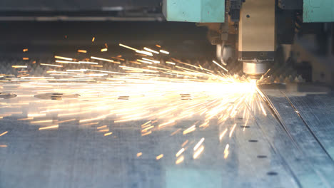 Bright-sparks-scatter-in-process-of-laser-metal-cutting.-Process-of-metalworking