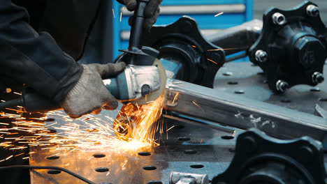 Worker-holding-angle-grinder-during-work.-Application-of-industrial-tool