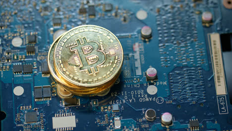 Modern-bitcoin-farm.-Gold-bit-coin-on-circuit-board