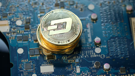 Virtual-cryptocurrency-business.-Gold-dashcoin-on-circuit-board