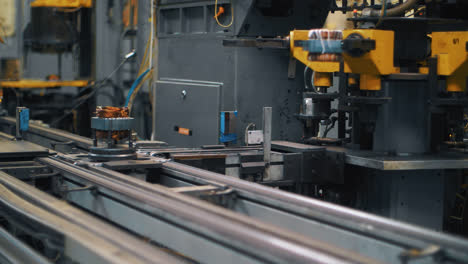 Metal-detail-with-copper-wire-moving-on-automatic-conveyor-on-factory