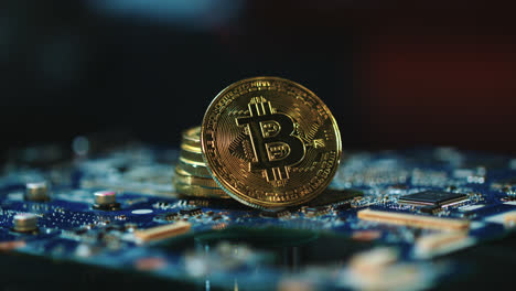 Modern-bitcoin-mining-business.-Bitcoins-on-circuit-board.-Blockchain-technology