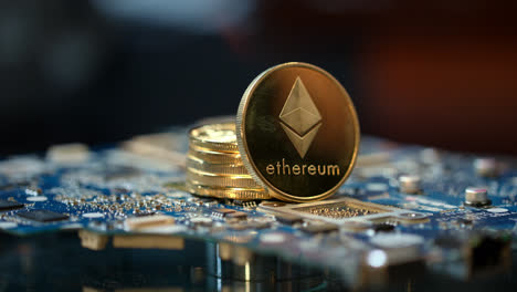 Cryptocurrency-mining-business.-Stack-of-gold-etherium-coins-on-circuit-board