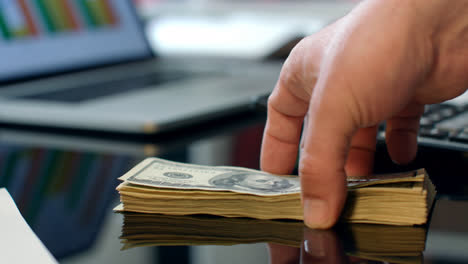 Transfer-heap-of-dollar-banknotes-from-hand-to-hand.-Instant-money-transfer