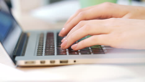 Woman-hands-working-on-laptop-computer.-Worker-typing-on-a-keyboard
