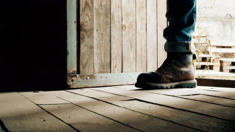 Male-feet-entering-inside.-Man-shoes-come-inside-wooden-house