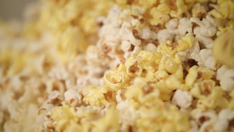 Ready-popcorn-flakes-falling-in-popcorn-machine.-Corn-flakes-production