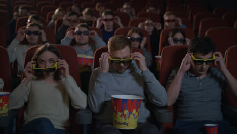People-wearing-3d-movie-glasses-in-cinema.-Movie-entertainment