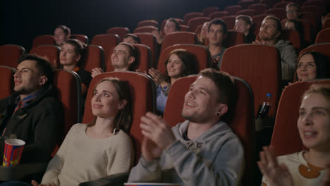 Funny-spectators-applaud-in-theater.-People-clapping-hands-at-theater