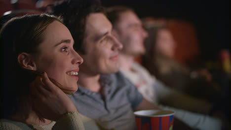 People-in-auditorium-watching-film.-Joyful-young-people-in-cinema