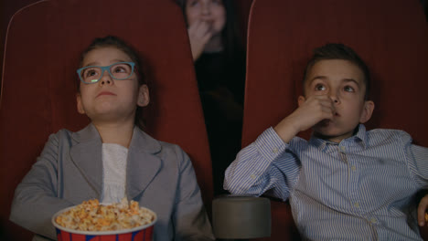 Young-spectators-watching-movie-at-cinema.-Movie-children-entertainment