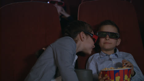 Beauty-children-in-3D-glasses-watching-movie-with-interest.-Movie-entertainment