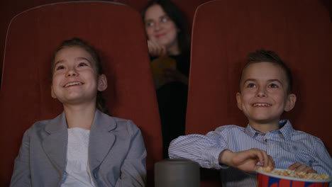 Children-laughing-at-cartoon-cinema.-Smiling-child-watching-funny-cartoon