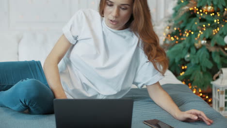 Aggressive-business-woman-getting-sad-news-on-laptop-computer.