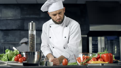 Chef-cooking-at-restaurant-kitchen.-Professional-chef-preparing-healthy-food