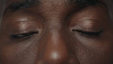 Extreme-closeup-surprised-african-american-male-eyes-looking-at-camera.