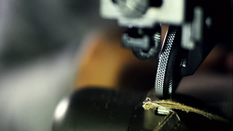 Handicraftsman-hand-manufacturing.-Close-up-sewing-machine-mechanism-in-work
