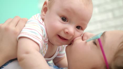 Happy-girl-kissing-baby-boy.-Close-up-of-girl-hug-infant