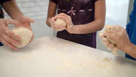 Mom-cooking-with-kids.-Family-cooking-cake-dough-together