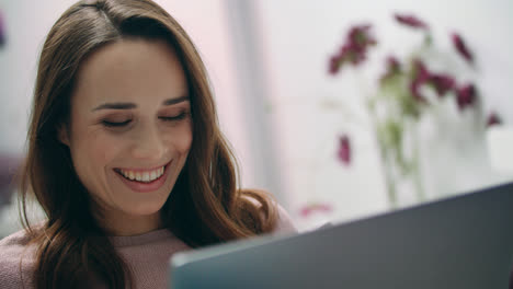 Happy-woman-laughing-looking-at-laptop-at-home.-Girl-making-online-video-call