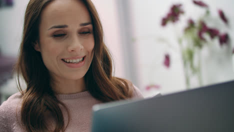 Portrait-of-happy-woman-smiling-while-making-video-call-at-laptop