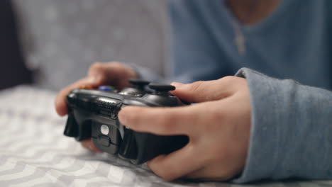 Boy-hand-playing-joystick.-Close-up-of-kid-hand-holding-video-game-joystick