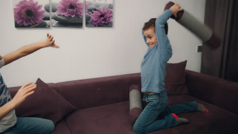 Brother-and-sister-fighting-pillow.-Siblings-pillow-fight.-Kid-have-fun-together