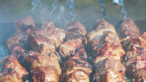 Bbq-meat-grilling-on-charcoal-grill.-Close-up-smoke-over-meat-barbecue-skewers