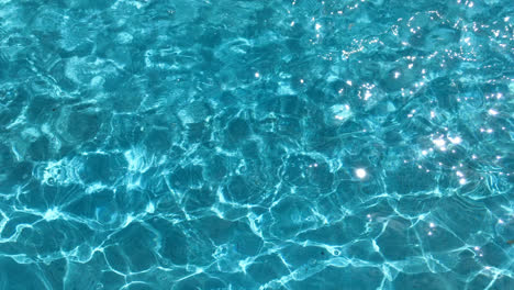 Rippled-water-surface-in-swimming-pool.-Blue-water-surface-background
